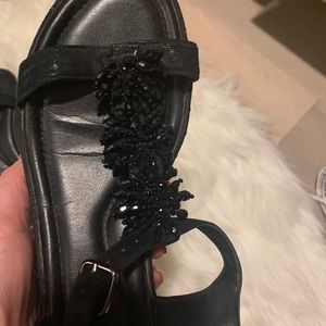 Black sandals with tossels